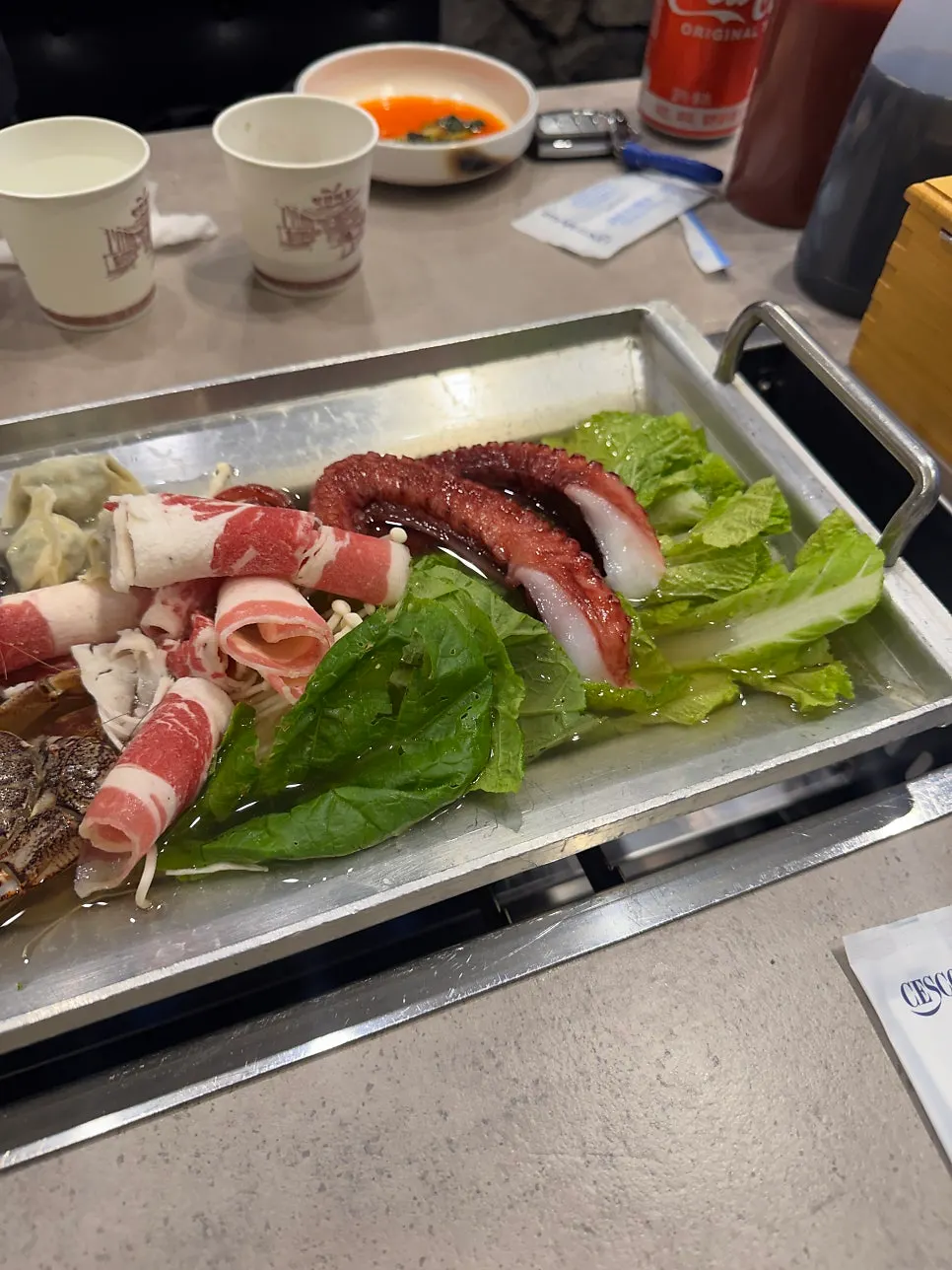 Pot with a fresh, still-moving abalone inside