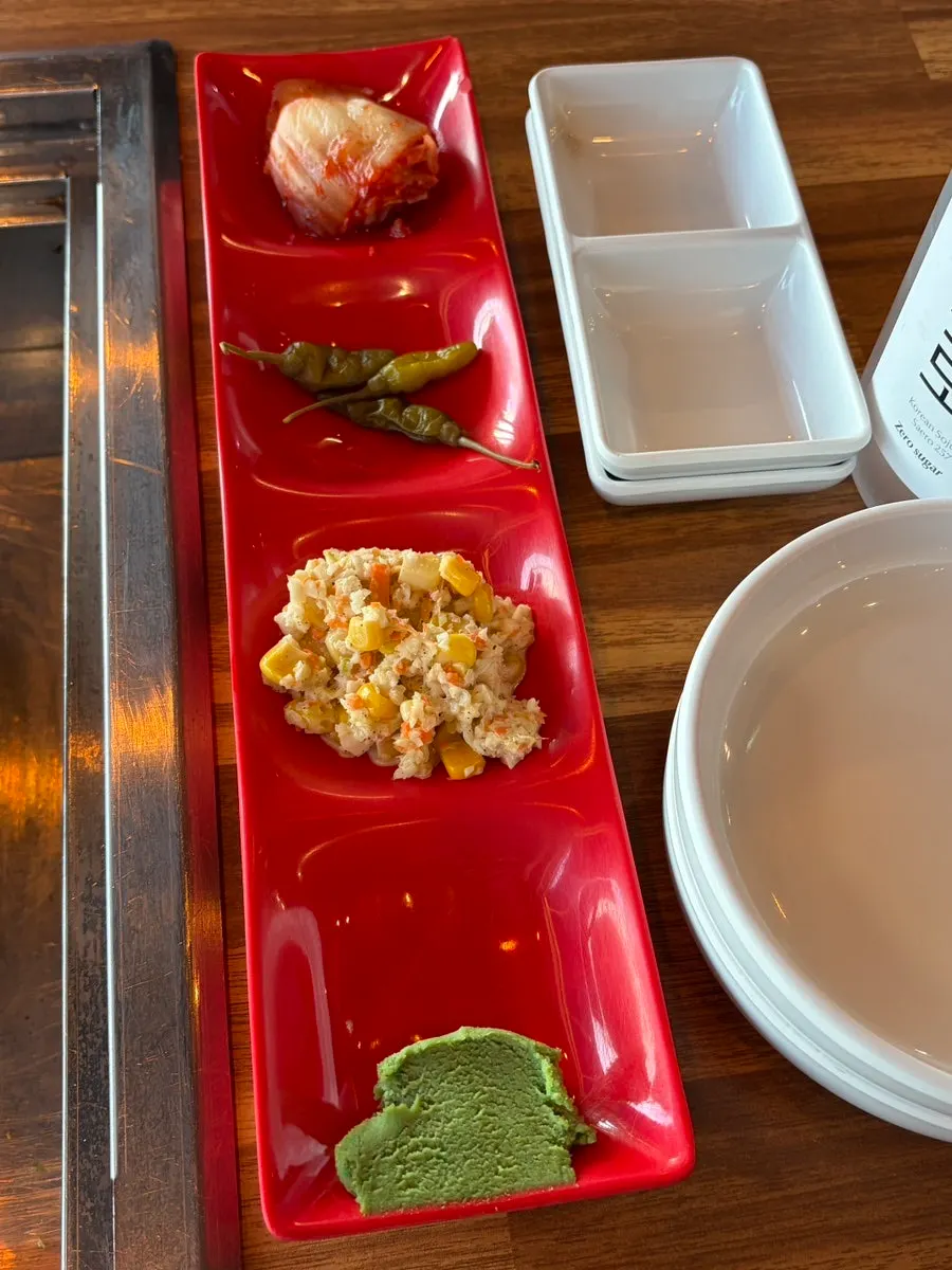 Basic side dishes: kimchi, pickled chili, sweet corn