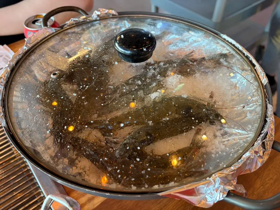 Salt-grilled giant shrimp set up next to the grill