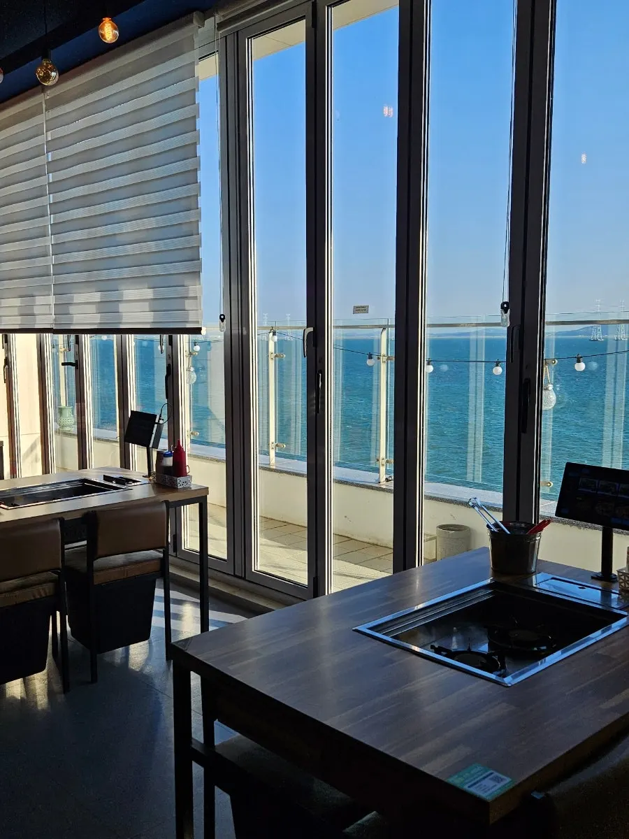 Interior of the restaurant with a grill set on the table