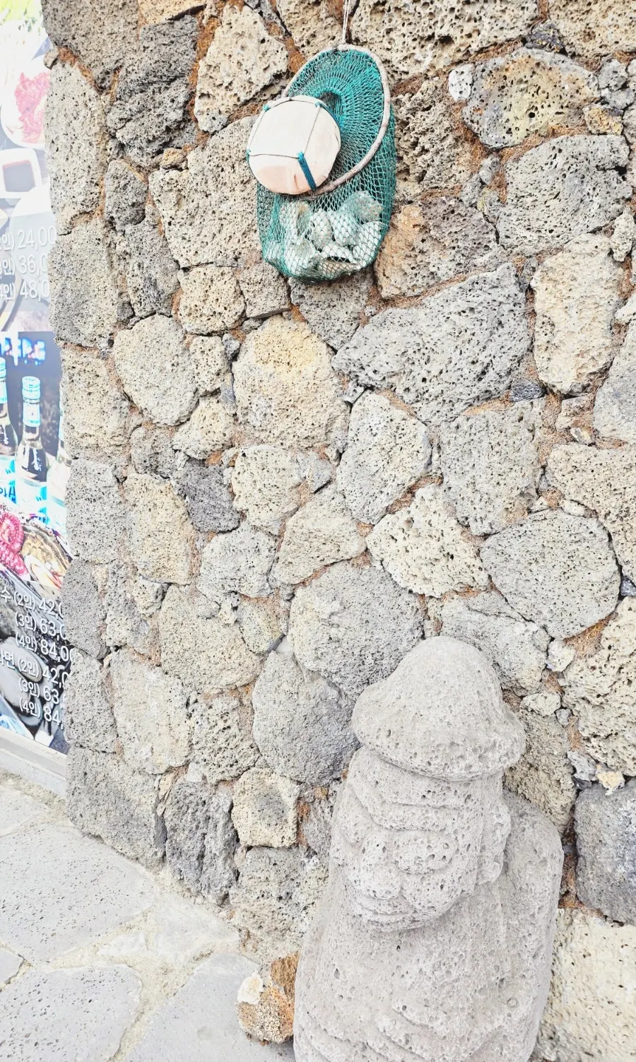 Entrance decorated with a haenyeo net basket