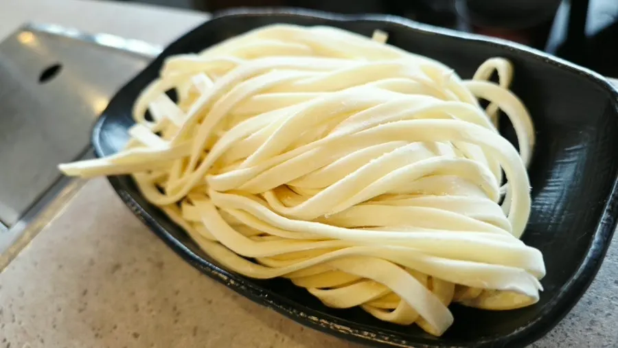 Raw kalguksu noodles served separately