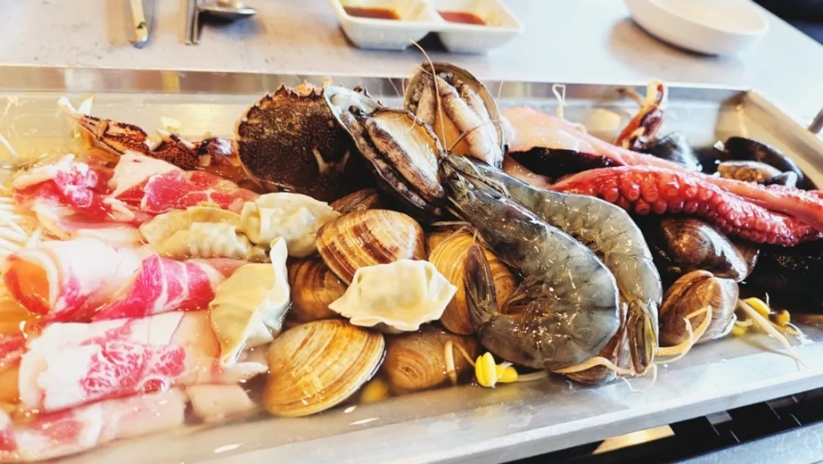 Seafood pot kalguksu for two, packed with seafood