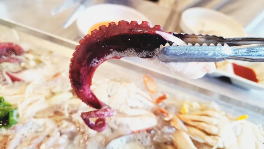 Whole octopus legs cooked in the broth