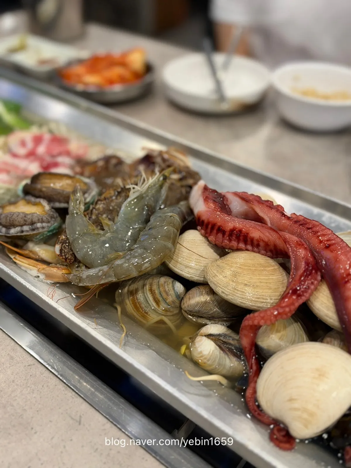 Seafood hot pan and kalguksu table setting at 52 Degree Kalguksu, Oido