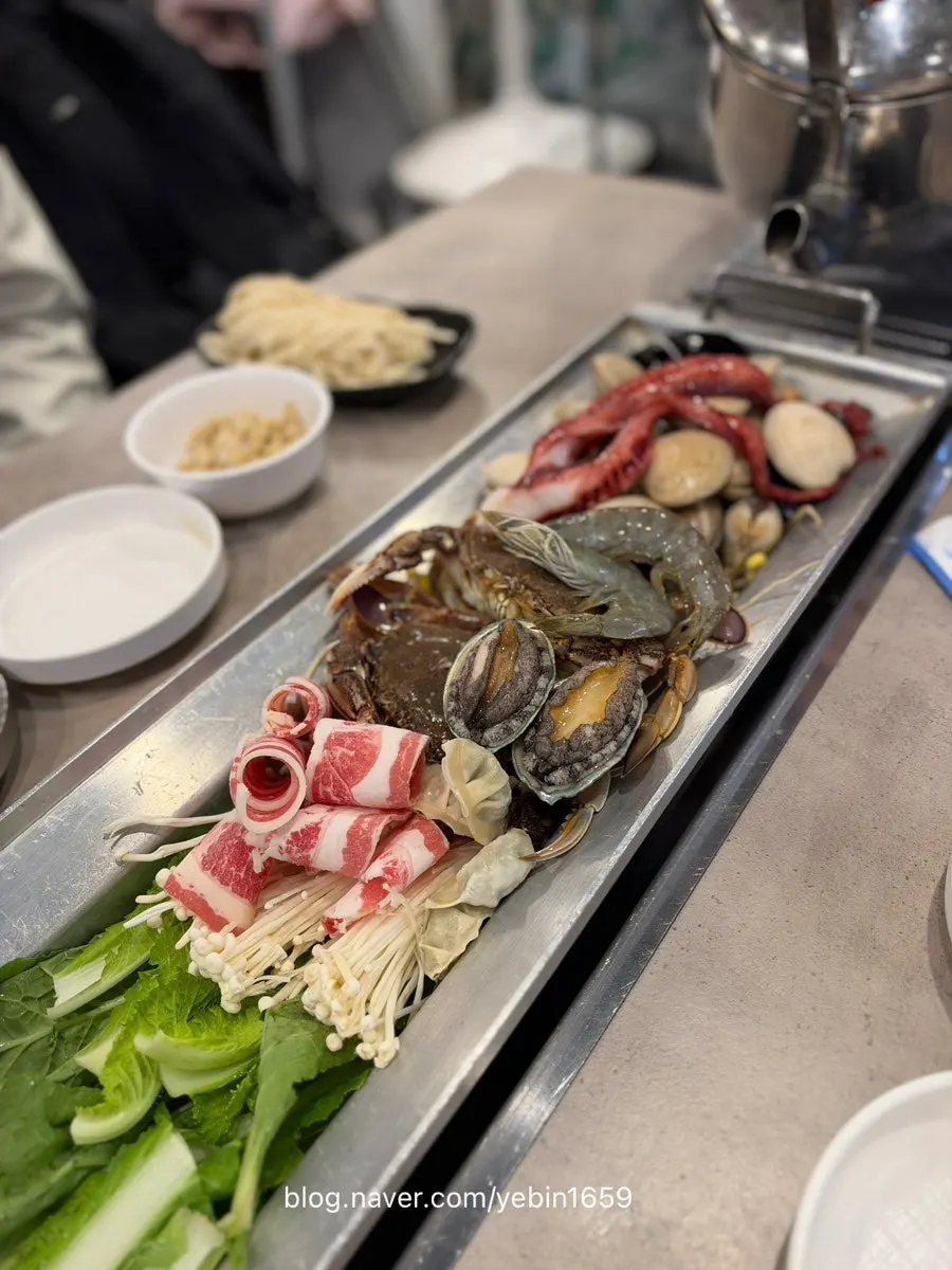 A hot pan piled full of seafood