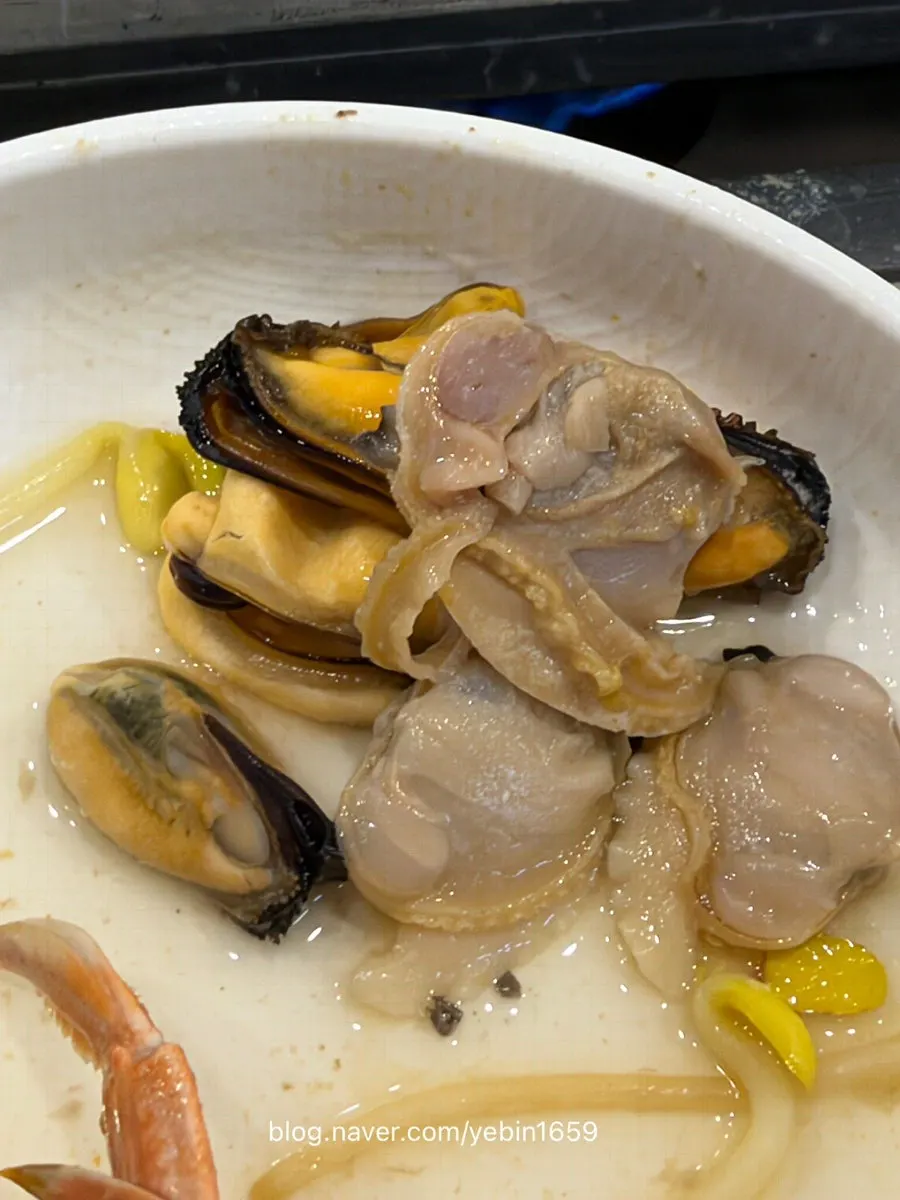 Seafood broth simmering in the hot pan