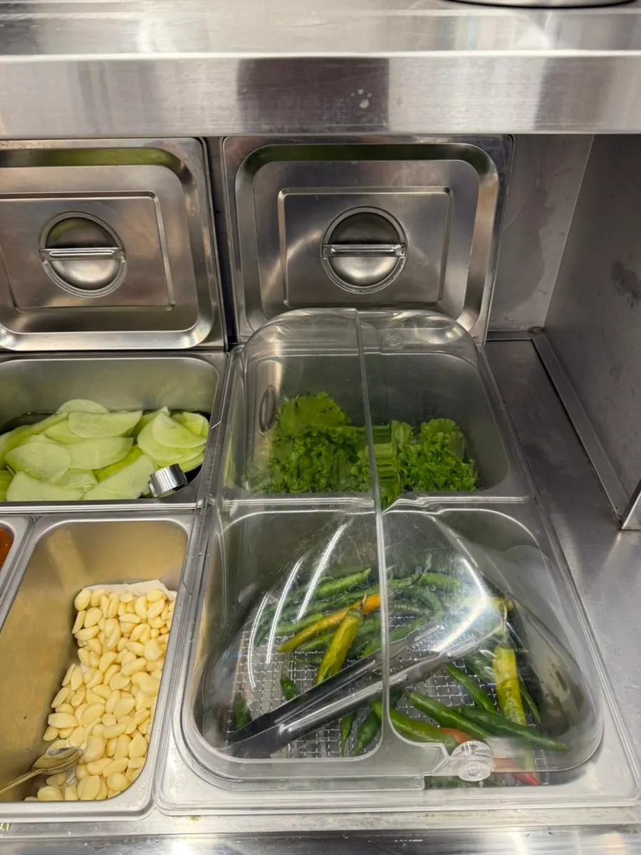 Kimchi and garlic at the self-serve banchan refill corner