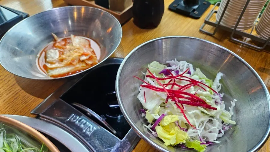 Close-up of the raw hanwoo bulgogi starting to boil