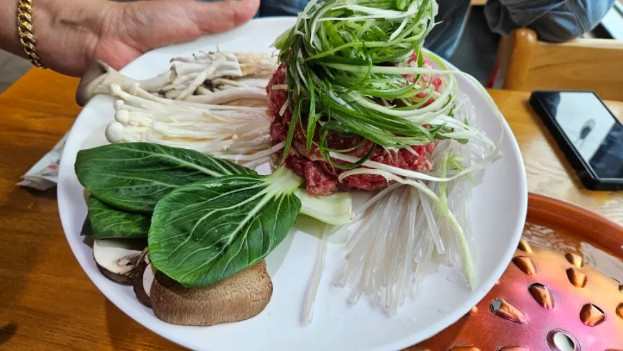 Side dish spread including salad and japchae
