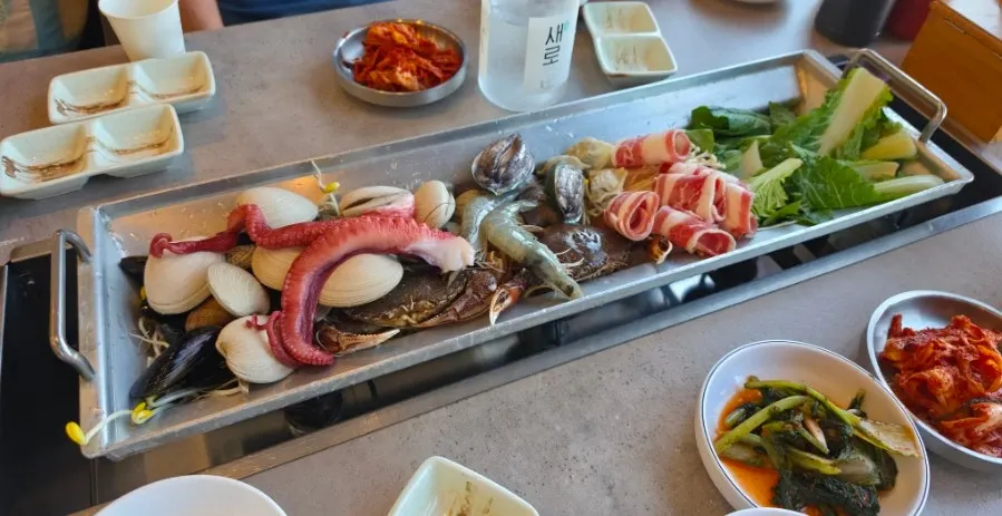 A pot of seafood hot pot kalguksu packed with seafood