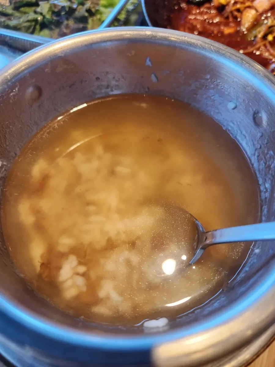 Sotbap scorched rice soaking in hot water