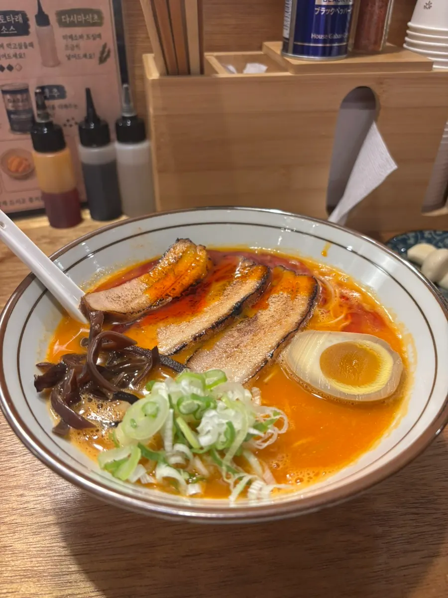 Thin noodles and broth of the tonkotsu ramen