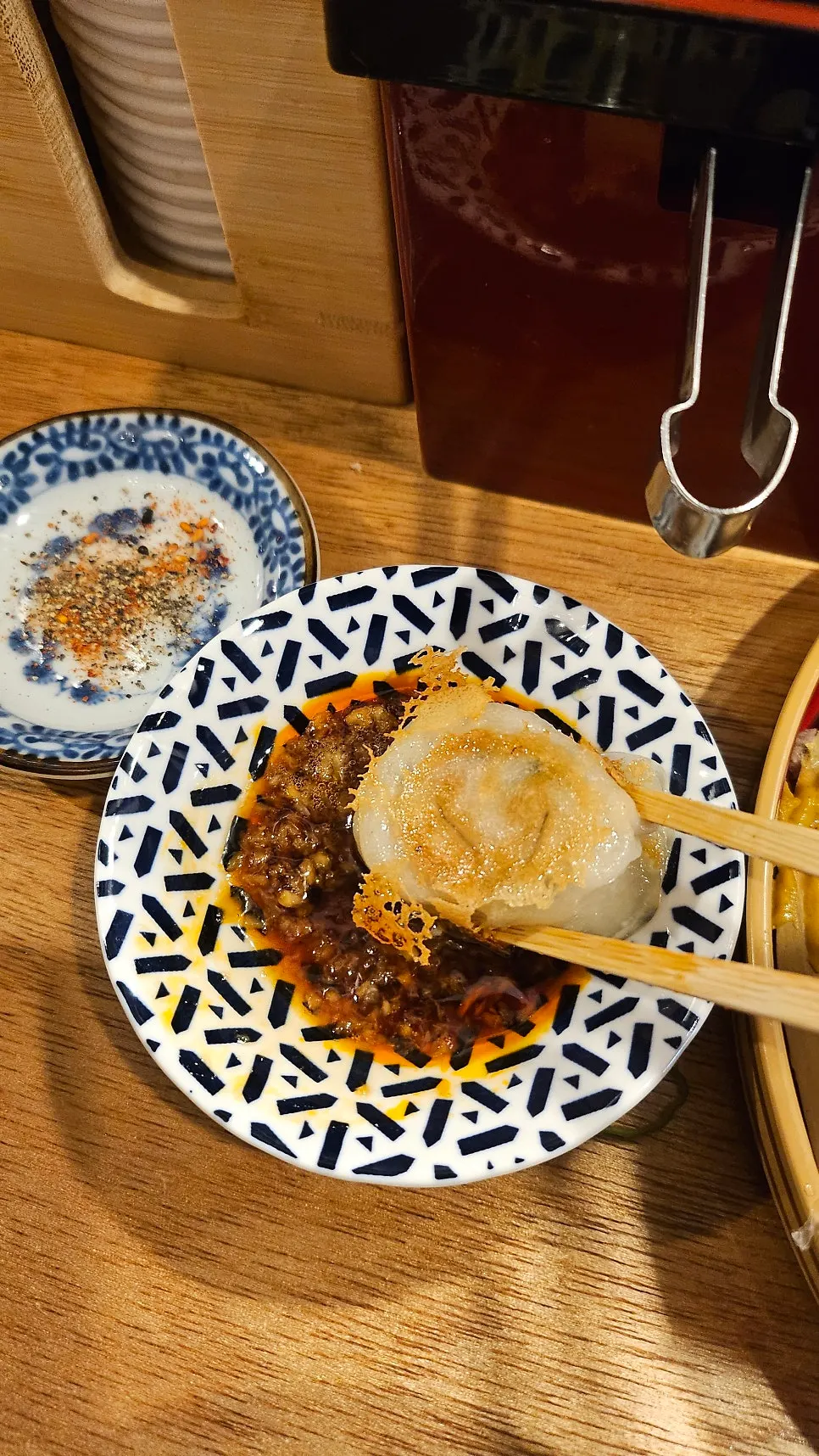 Handmade hanip gyoza dipped in garlic soy sauce