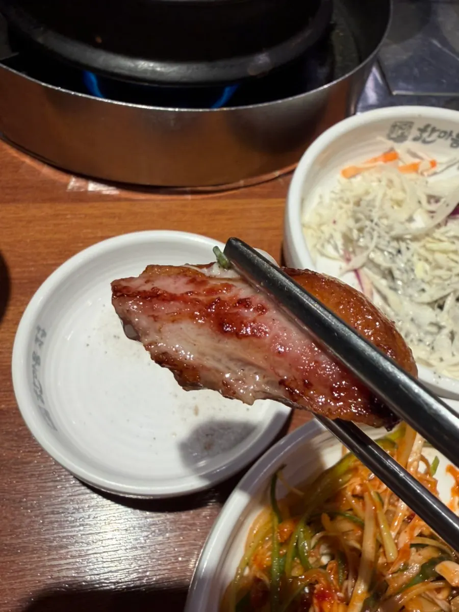 Half-pig set being grilled