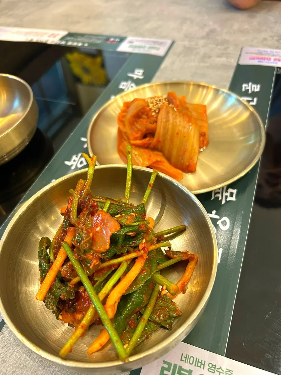 Basic side dishes of stir-fried kimchi and mixed boiled pork salad