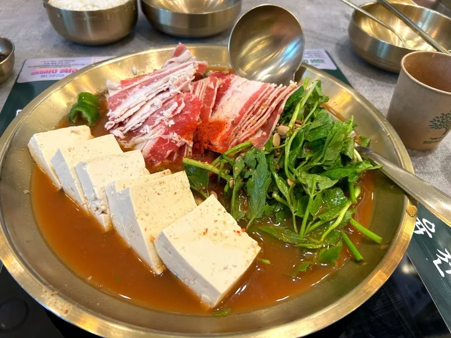 Beef pork belly doenjang hot pot served as two portions
