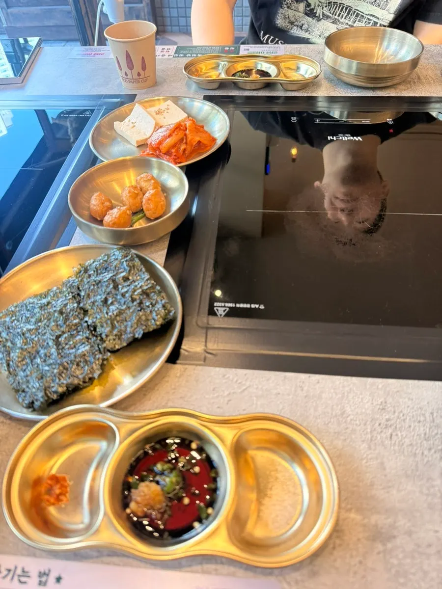 Basic side dishes including tofu kimchi and braised quail eggs