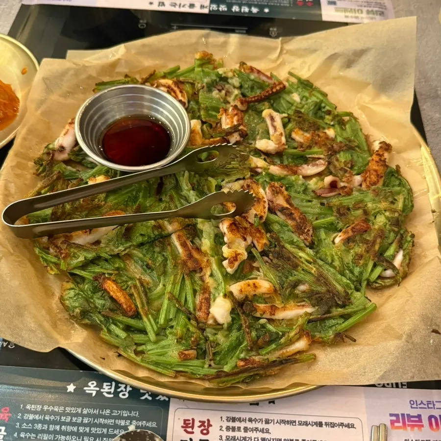 Large squid minari pancake served at the table