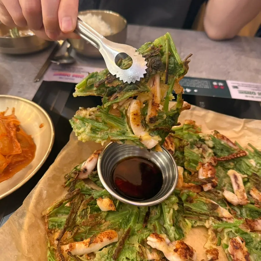 Cross-section of the squid minari pancake served with soy sauce dip
