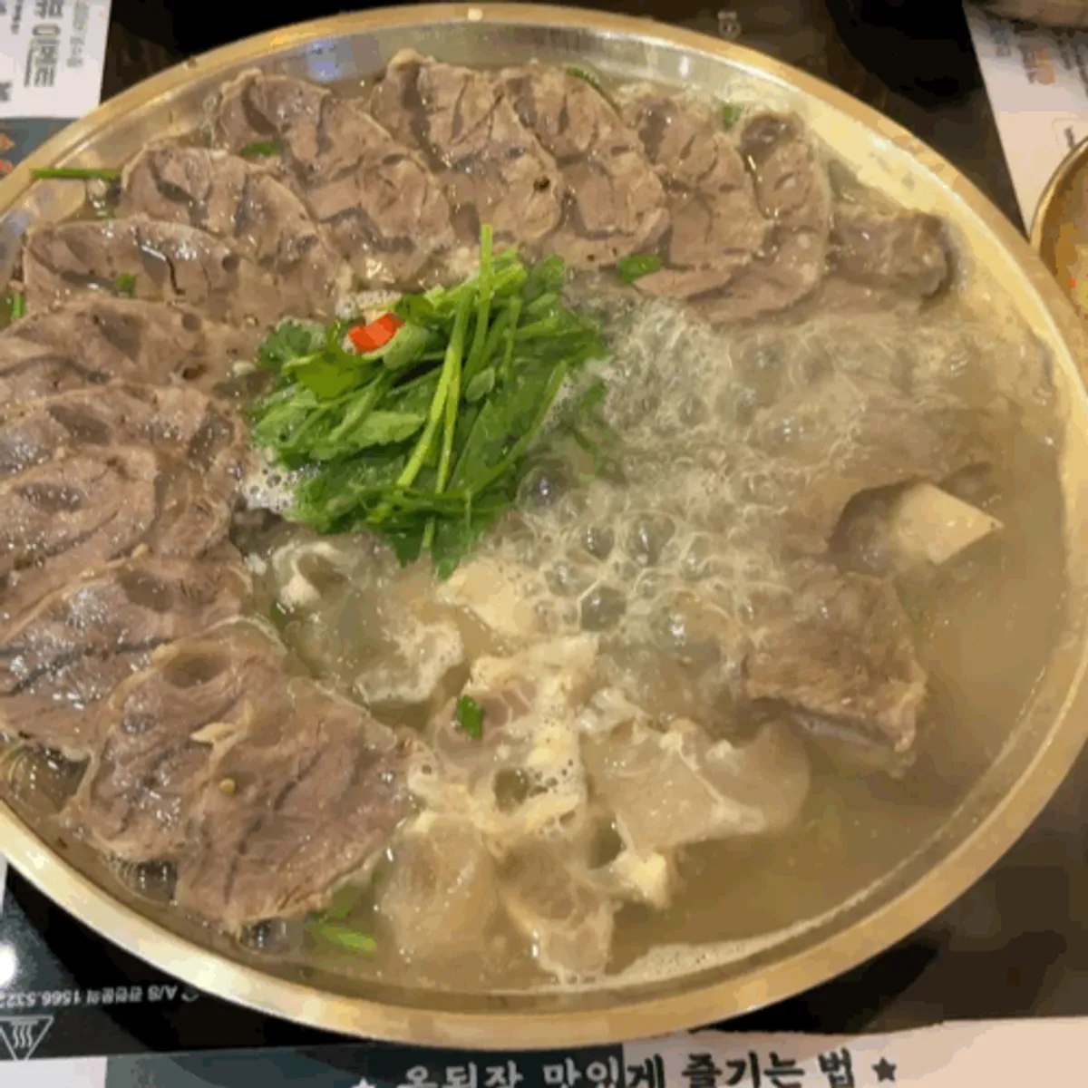 Table spread of boiled pork hot pot at Okdengjang Seohyeon Branch
