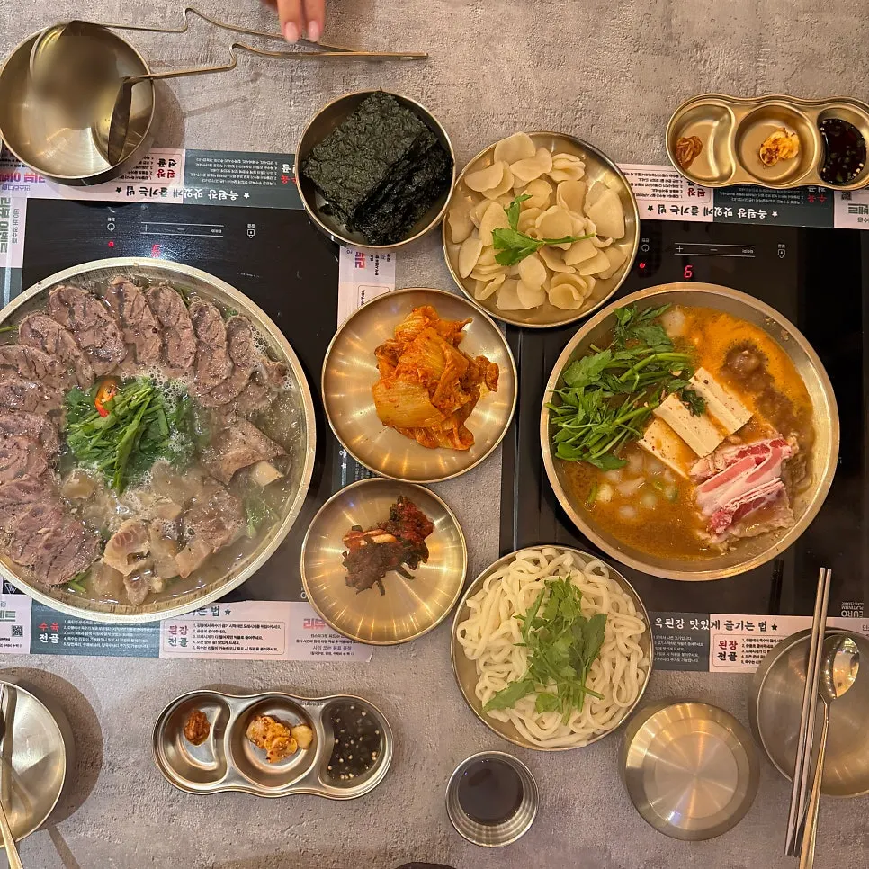 Ordered hot pots and basic side dishes on the table