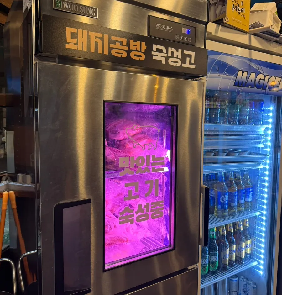 Interior of an Okgil-dong Korean BBQ restaurant with window seats