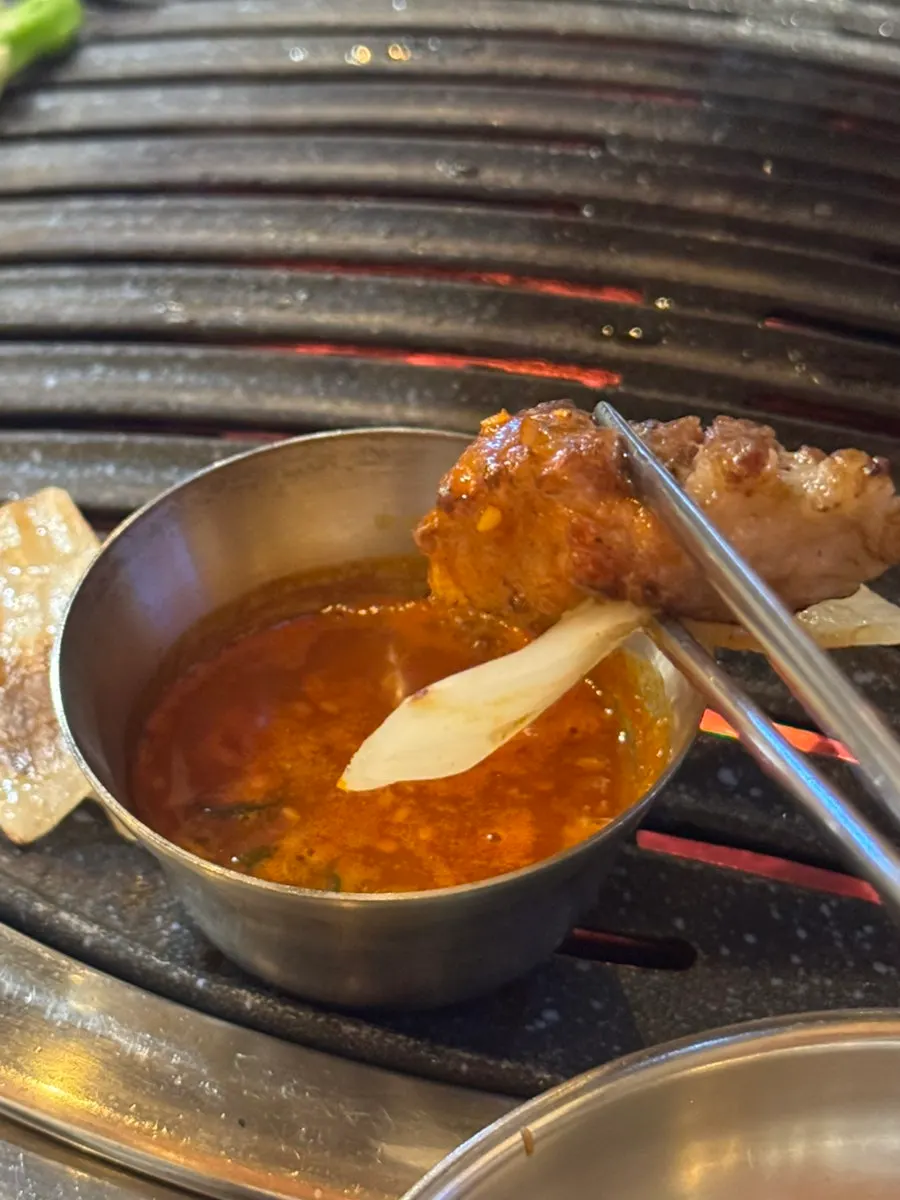 Meat paired with baek kimchi and wasabi