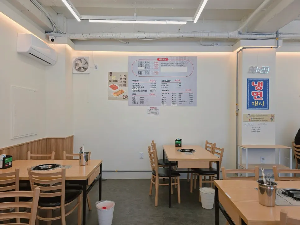 Dining hall seating with wood-toned tables and chairs