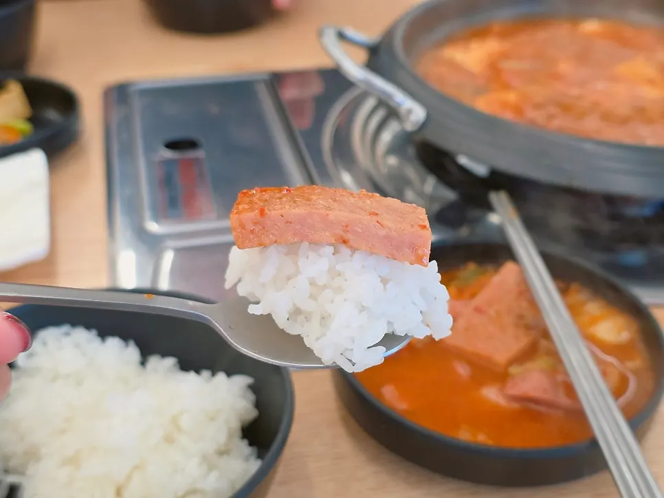 Ham and sausage from budae-jjigae piled on rice