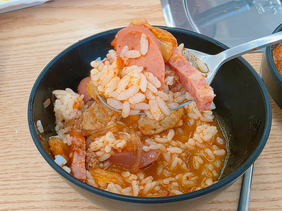 Rice mixed into budae-jjigae broth to finish the meal