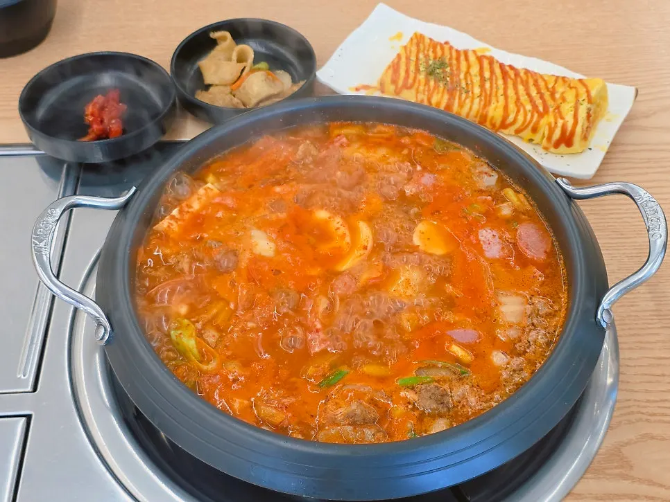 Table set with both budae-jjigae and egg roll