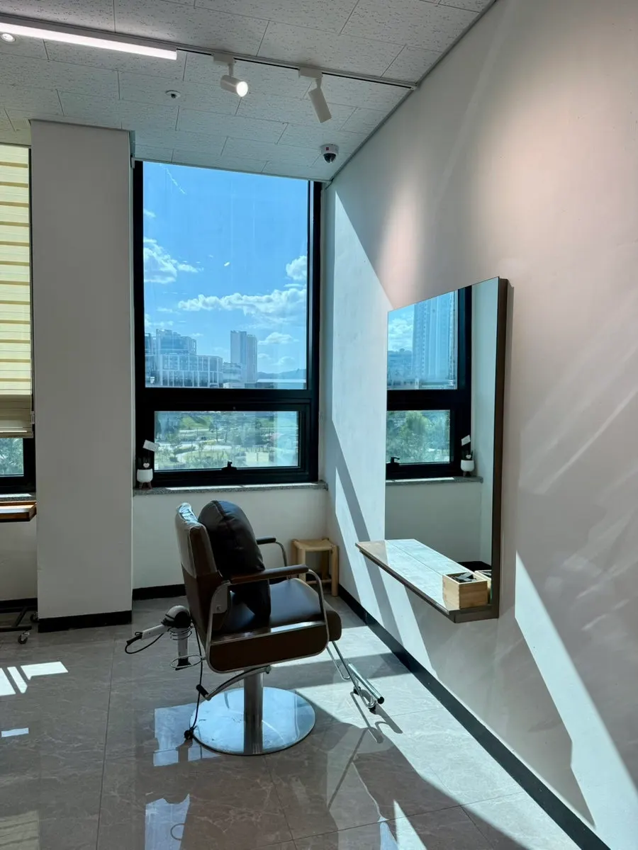 Salon interior with natural light streaming in