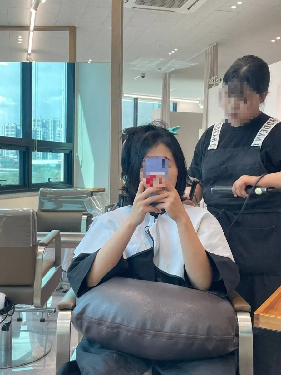 Checking hair condition during the straightening process