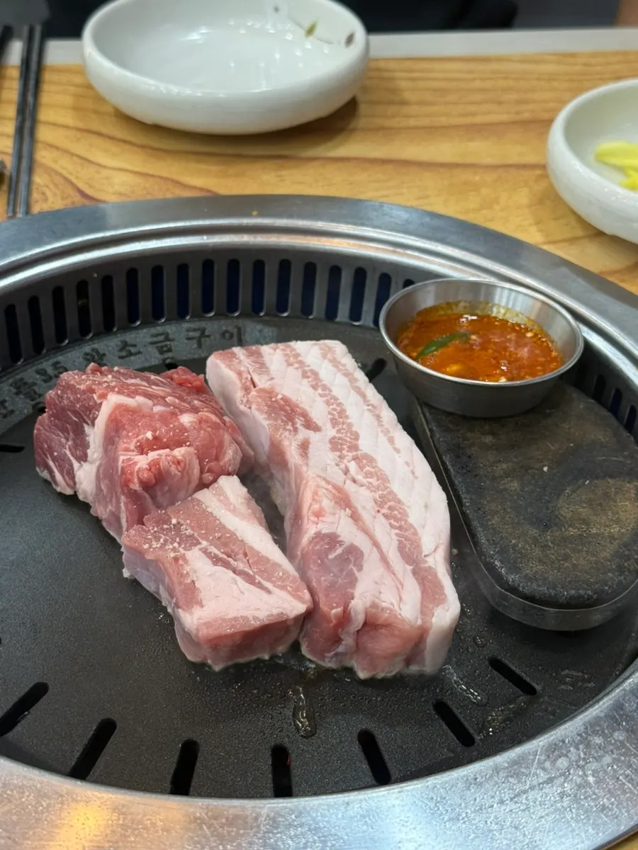 Pork belly and potatoes on the grill