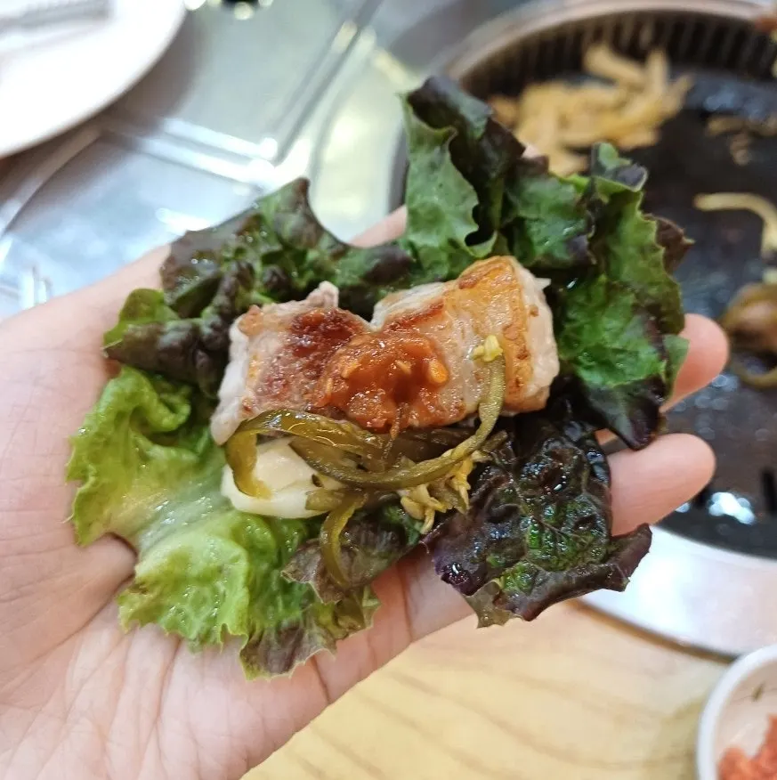 Salted shrimp cooked on the grill alongside pork belly
