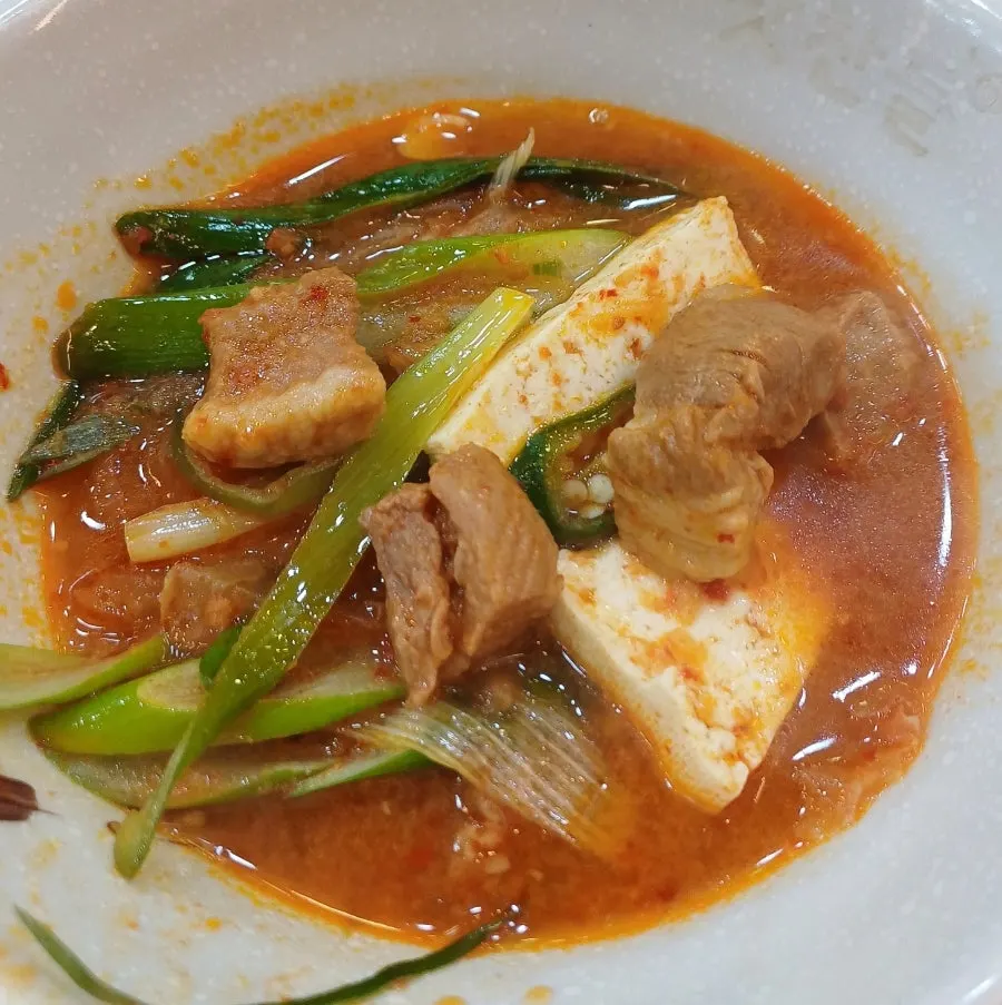 Aged kimchi stew with pork, tofu, and ramen noodles