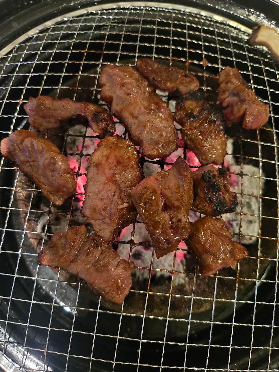 Bbolsal slowly cooking over weakened charcoal heat