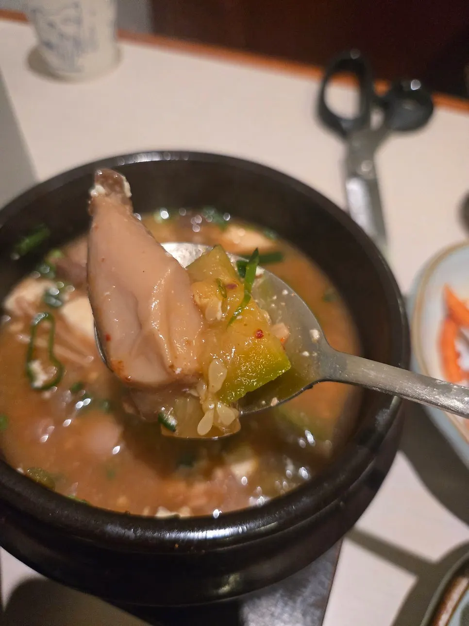 Table set with rice, doenjang stew, and meat