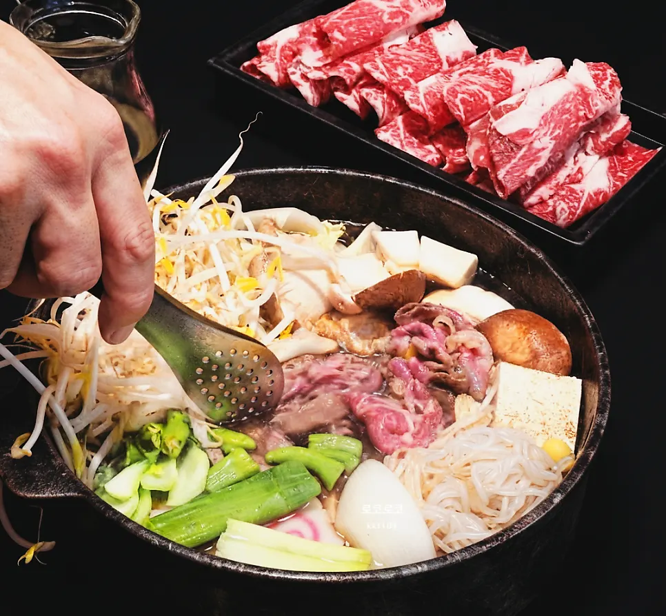 Table with the sukiyaki pot set on top