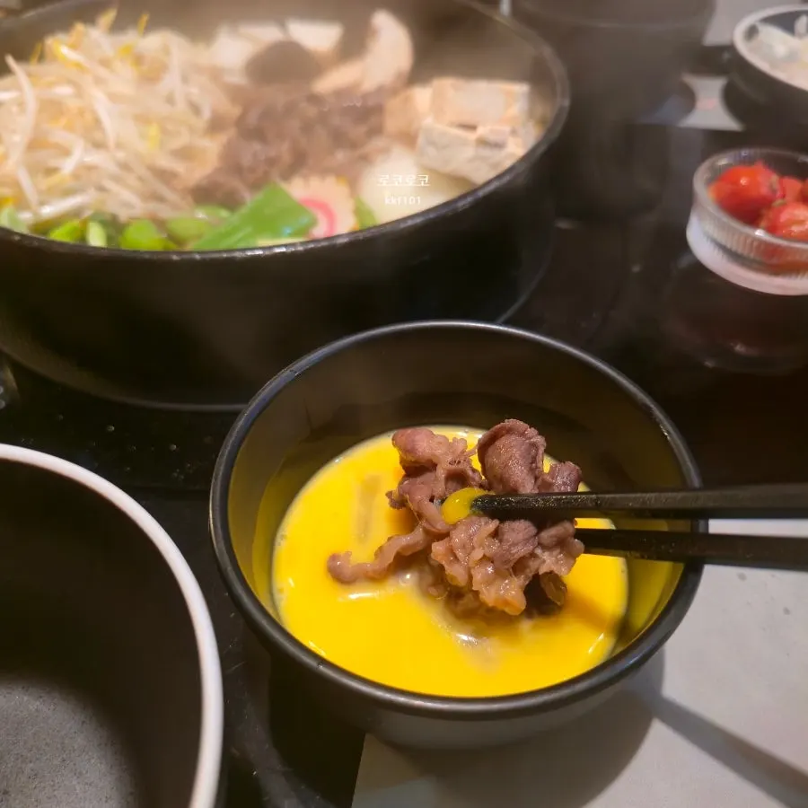 Sukiyaki beef dipped in raw egg