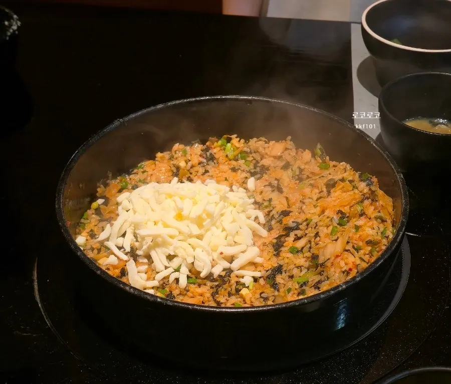 Kimchi fried rice being stir-fried