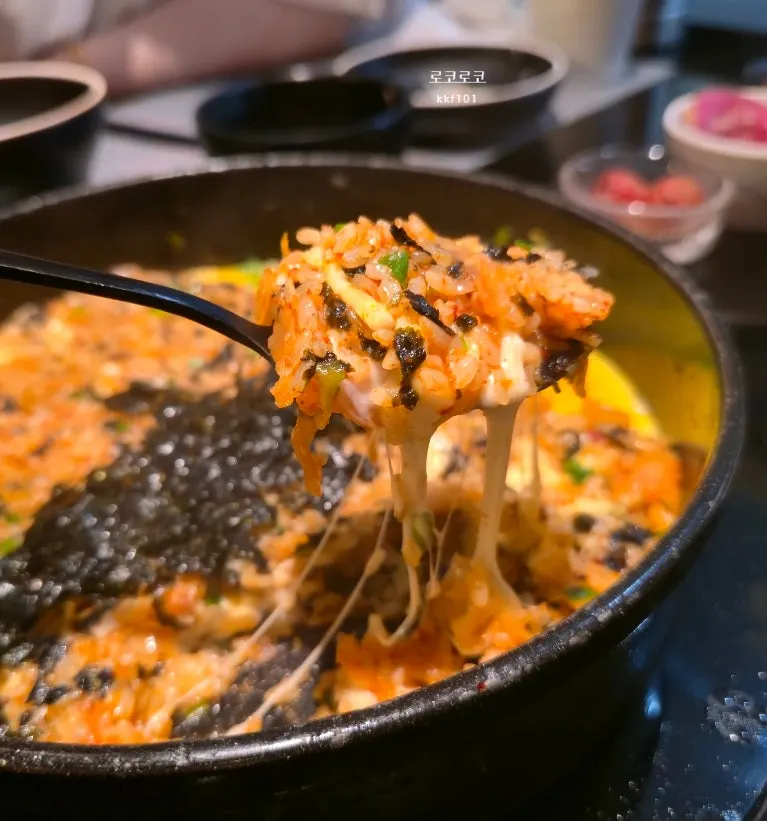 Stretchy cheese pull on the kimchi fried rice