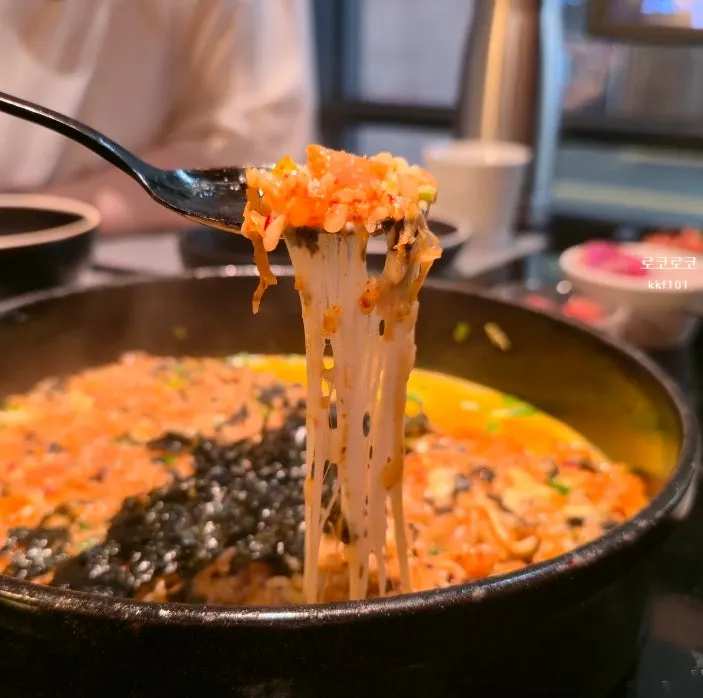 A spoonful of the mozzarella kimchi fried rice
