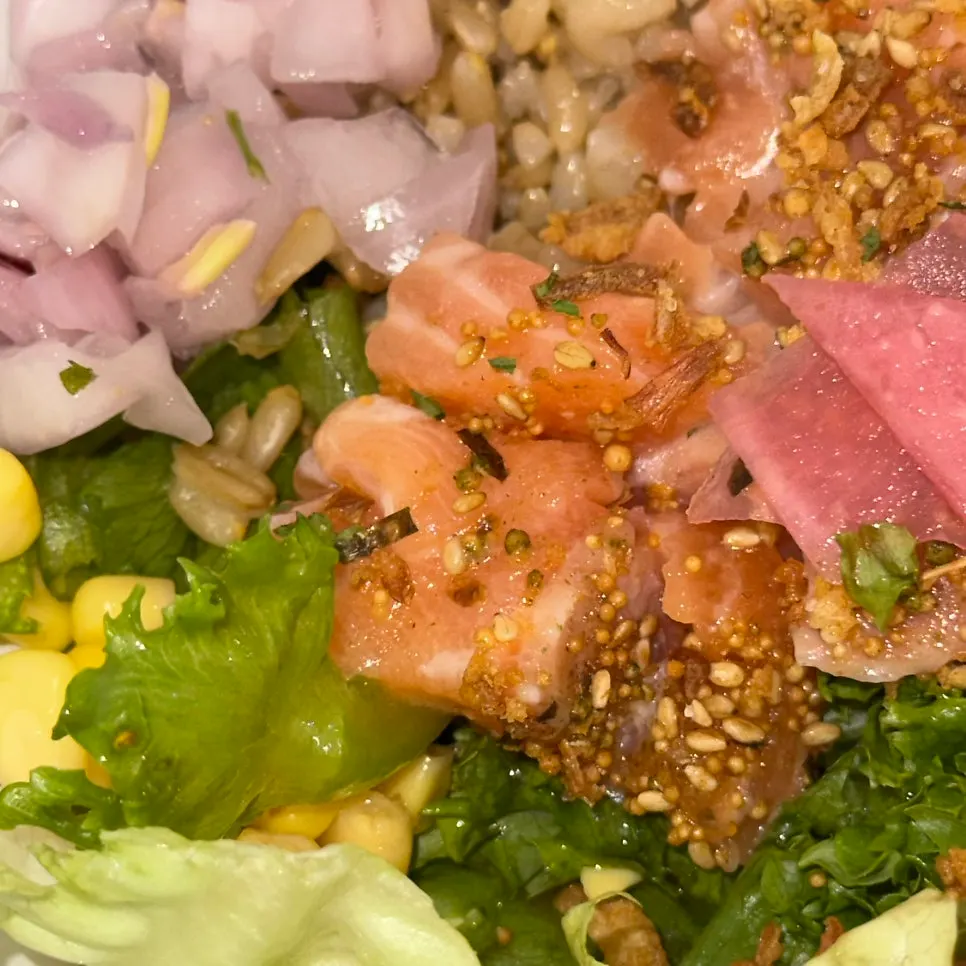 Close-up of salmon poke with toppings