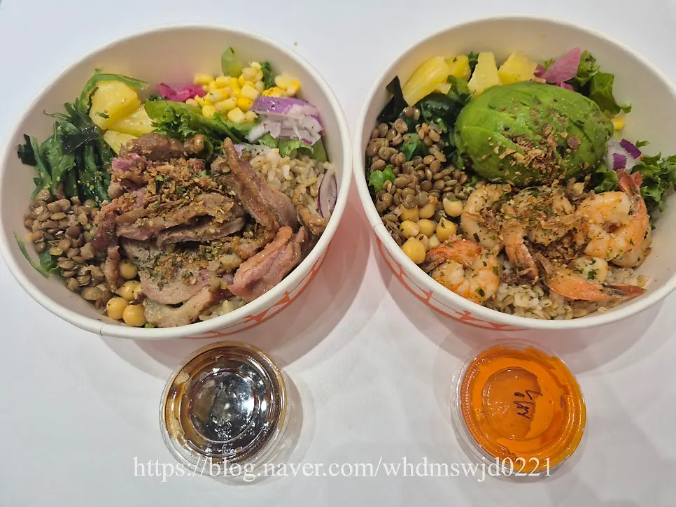 Two bowls: garlic shrimp poke and smoked duck poke