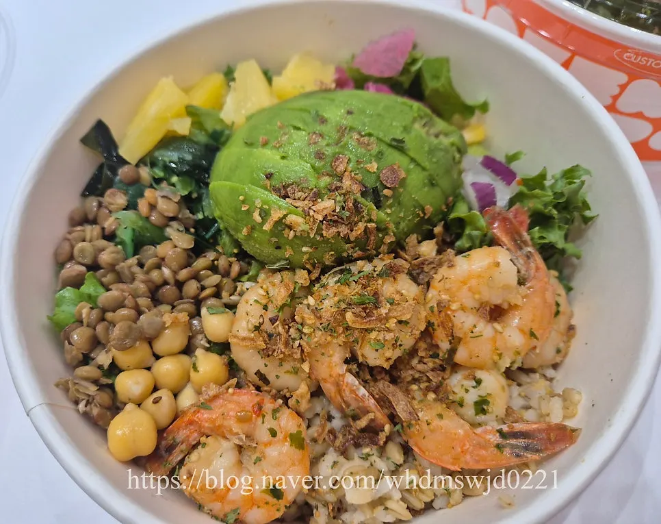 Close-up of garlic shrimp poke with chickpeas and pineapple