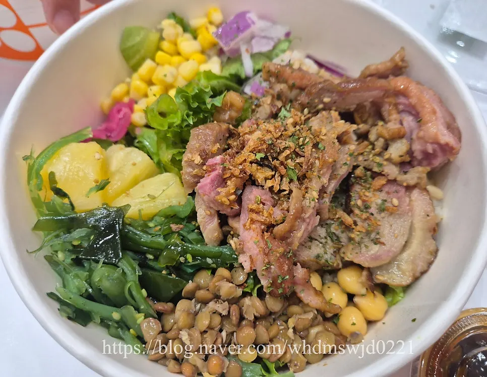 Close-up of seasoned seaweed ingredient in smoked duck poke