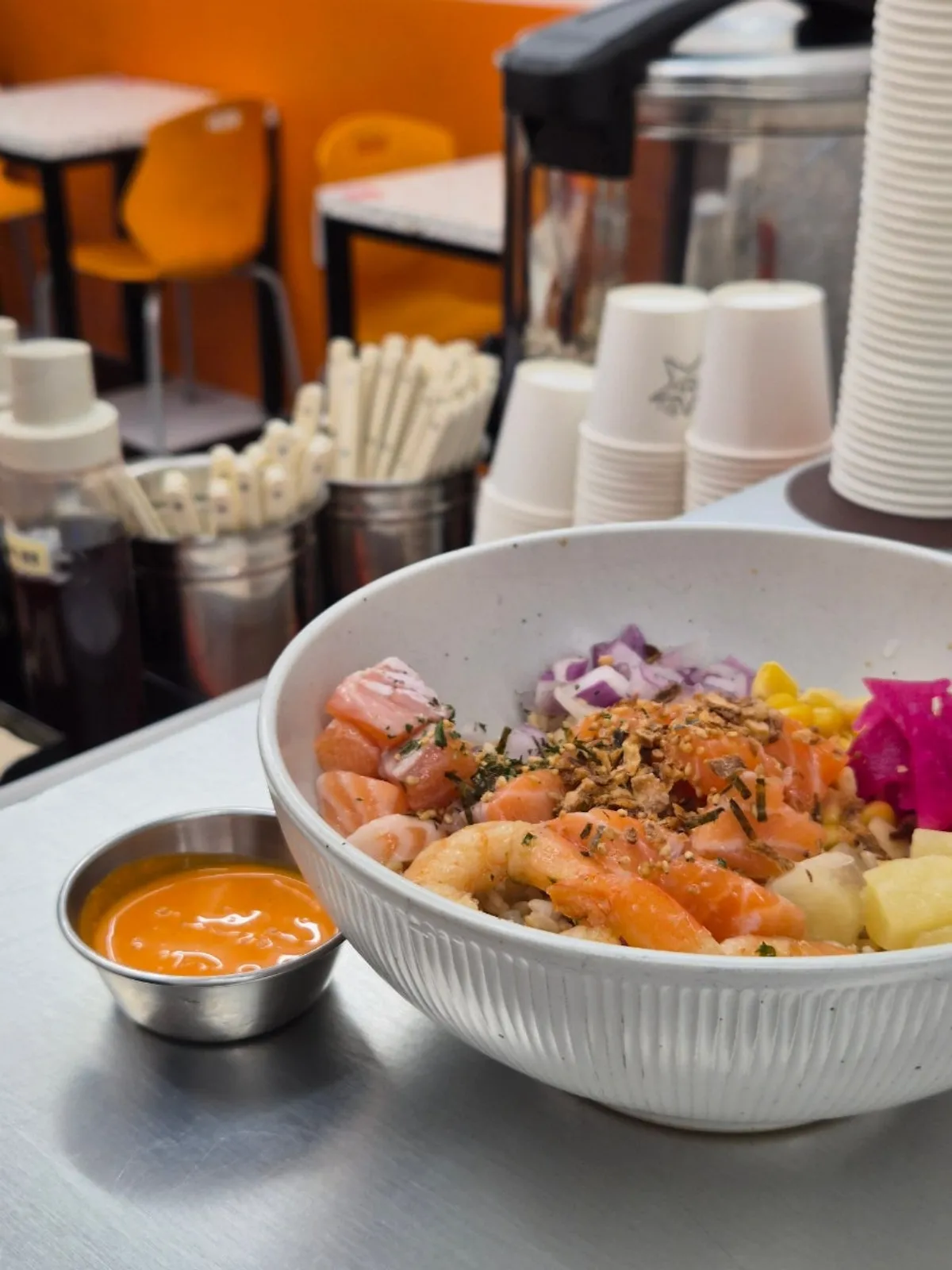 Rice-base salmon poke with topping arrangement