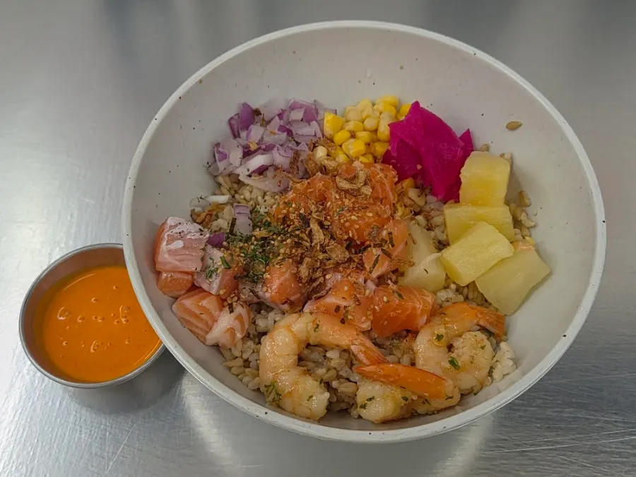 A bowl of salmon poke with disliked ingredients removed